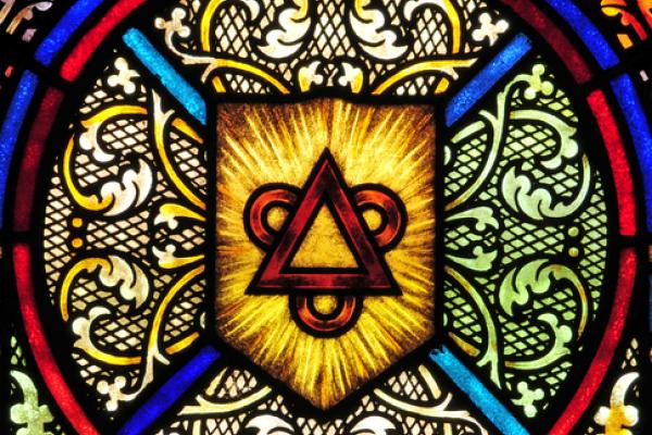 Stained glass window representing the Trinity, Nancy Bauer / Shutterstock.com