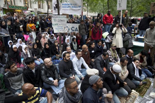 Imam leads muslims in a sermon at Occupy Wall Street by Lev Radin/Shutterstock.