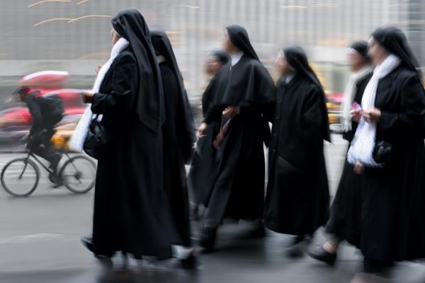 Group of a nuns walking, SVLuma/Shutterstock.com