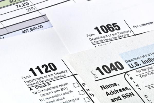 Photo: Tax forms,  © Garry L. / Shutterstock.com