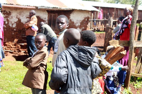 Tom Gowon, 9, in a brown jacket, with his fellow refugees at Baga Sola camp, Cha