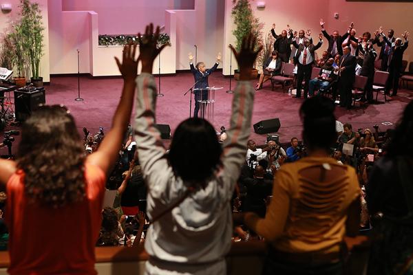 Rev. Al Sharpton speaks at Greater Grace Church in Florissant on Sunday. Image v