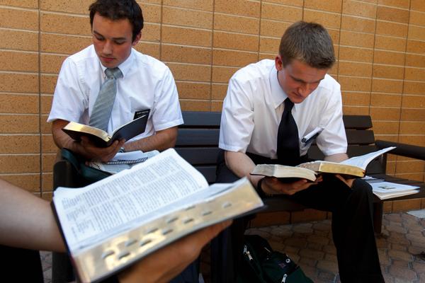 Two students study mormon scriptures at the Missionary Training Center. Photo co