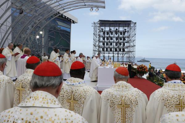 Cardinals stand nearby as Pope Francis celebrates the closing Mass of World Yout