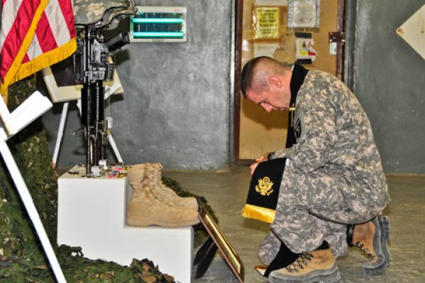 Army Chaplain Capt. Joseph Odell mourns a fallen soldie. RNS photo via Odell.