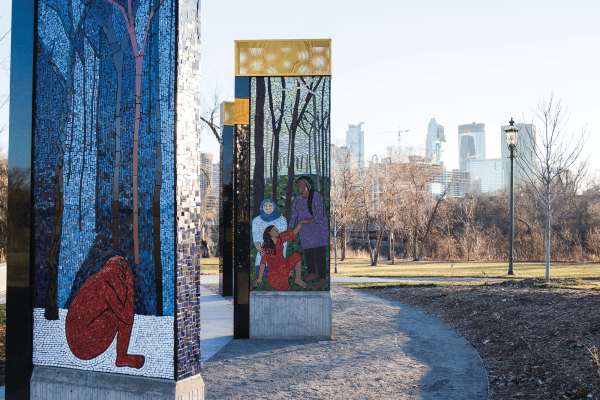 A Memorial to Survivors of Sexual Violence in Minneapolis. The murals are done with mosaics of blue, silver, brown and red colors.