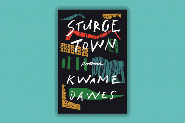 The image is of the book called Sturge Town which is a poetry collection. The book is a dark gray with shapes in red, blue, green, and yellow