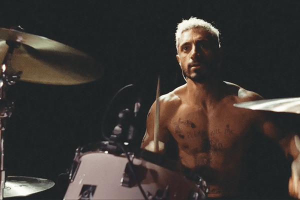 A drummer sits at his drum set in a scene from 'Sound of Metal'