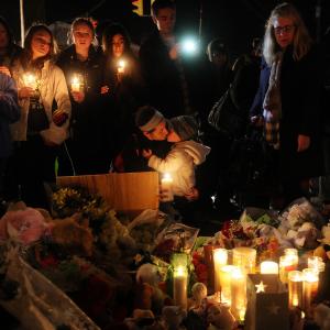 Rachel Pullen (C) kisses her son Landon DeCecco at a memorial for victims near the school. Mario Tama/Getty Images Mario Tama/Getty Images