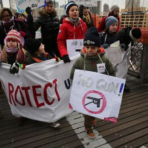 Participants with One Million Moms for Gun Control march across the Brooklyn Bridge on January 21. Spencer Platt/Getty Images Spencer Platt/Getty Images