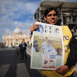 A man sells newspapers outside St Peter's Square on Thursday morning. Dan Kitwood/Getty Images Dan Kitwood/Getty Images