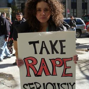 Protester holding placard, 2010. Image via Wylio. http://bit.ly/rXM1Om Protester holding placard, 2010. Image via Wylio. http://bit.ly/rXM1Om