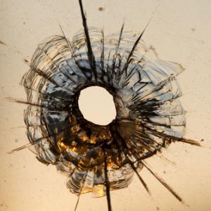 Gun shot in window, Iurii Konoval / Shutterstock.com Gun shot in window, Iurii Konoval / Shutterstock.com