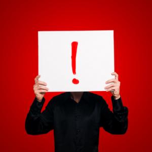 Man Holding Sign Exclamation Eugenio Marongiu / Shutterstock Man Holding Sign Exclamation Eugenio Marongiu / Shutterstock