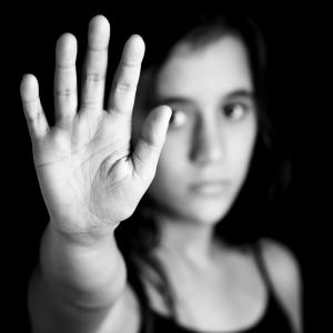 A woman holds up her hand. Image courtesy Kamira/shutterstock.com A woman holds up her hand. Image courtesy Kamira/shutterstock.com
