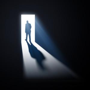  man walking through open doors, Mopic / Shutterstock.com