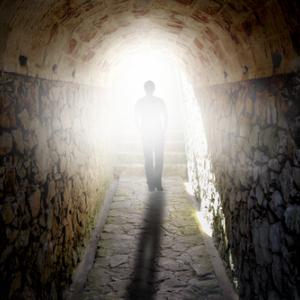 A figure walks towards the light. Photo courtesy BEELDPHOTO / shutterstock.com Photo courtesy BEELDPHOTO / shutterstock.com