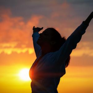 Woman praising, irima / Shutterstock.com