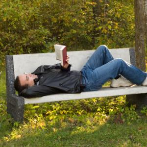 Man reading in the park, dragon_fang / Shutterstock.com