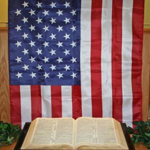 American flag and the Bible, SUE ASHE / Shutterstock.com