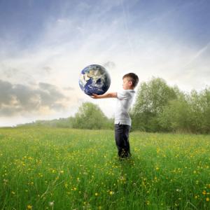 Child holding the earth, olly, Shutterstock.com