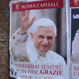 A poster of Pope Benedict XVI on the streets of Rome. The conclave will begin on Tuesday. RNS photo by David Gibson RNS photo by David Gibson