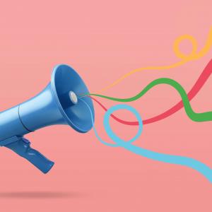 An illustration of a megaphone with colorful ribbons streaming out. 