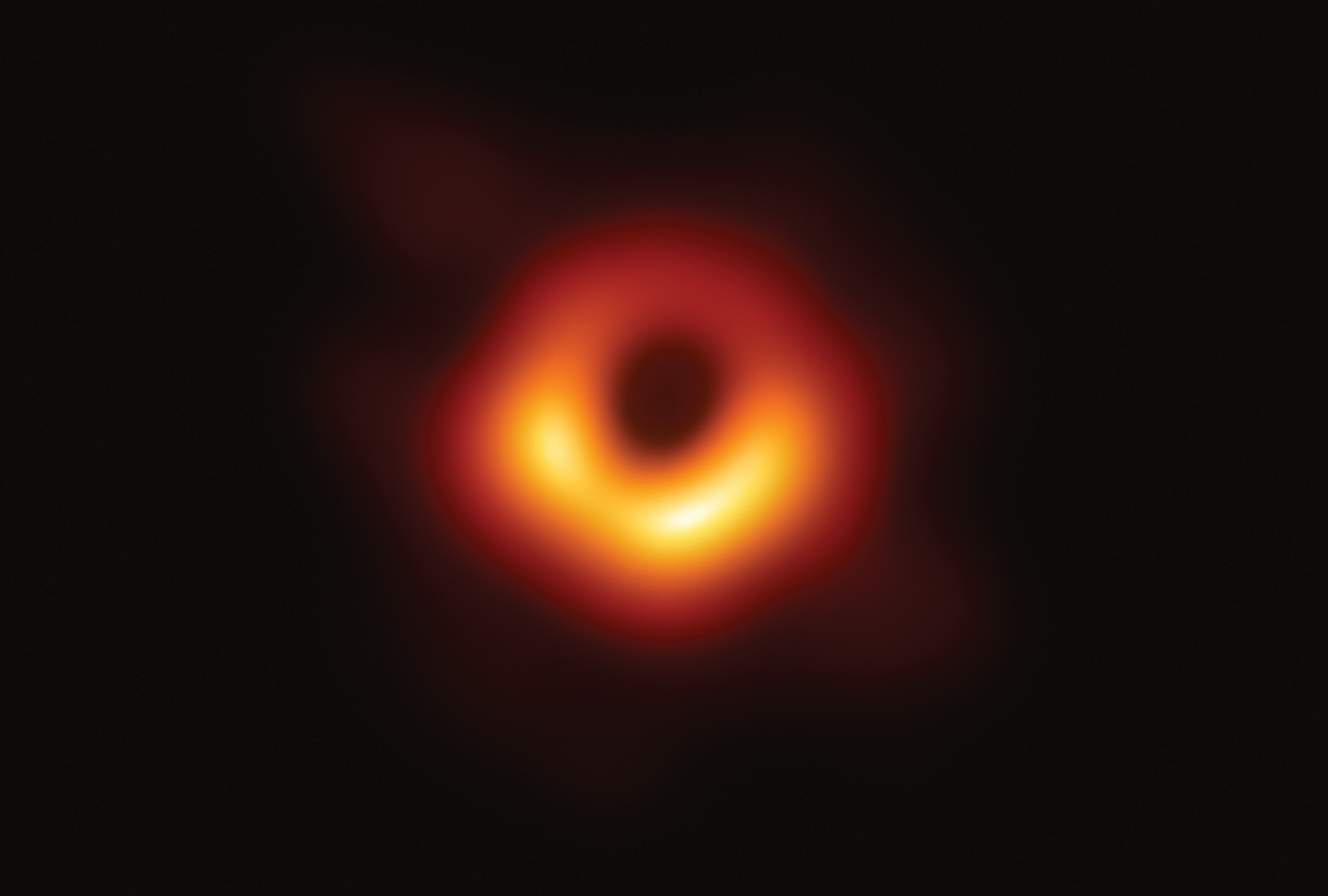 a black hole including its shadow, displaying a ring-like structure with a dark central region