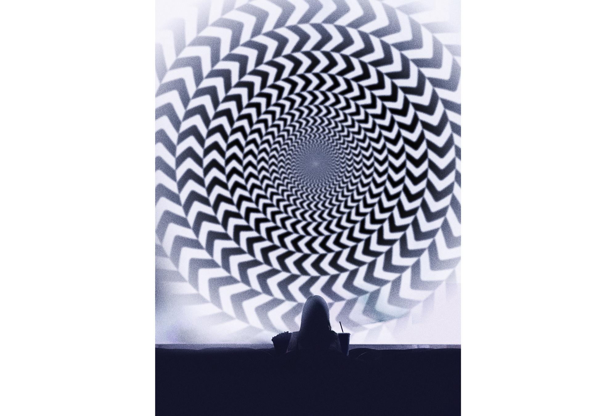 An illustration featuring a black-and-white illustration of a theater screen with a circular, mesmerizing, and disorienting pattern. A lone person with long hair sits in one row with popcorn and a drink held in both hands.