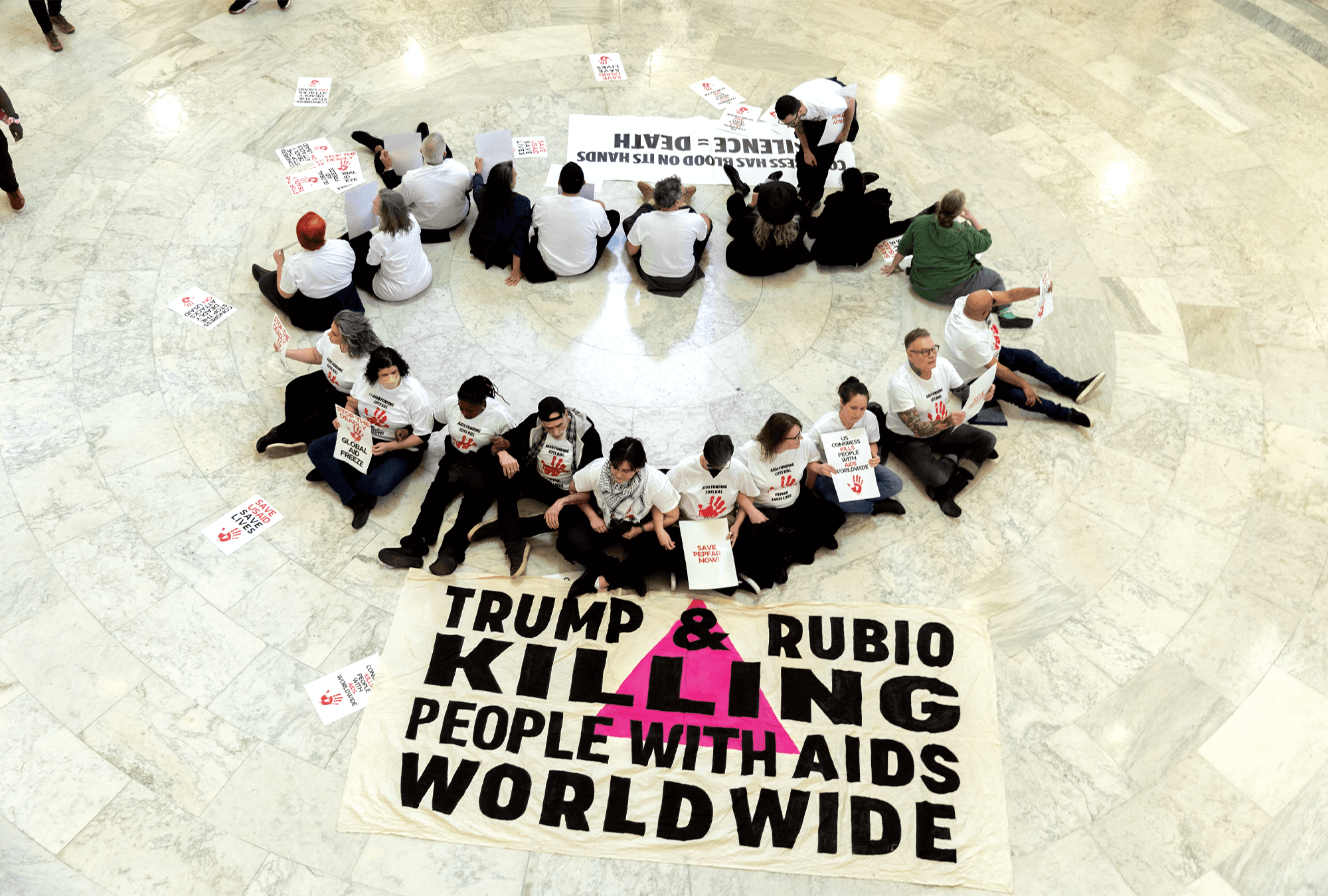 In Washington, D.C., fired USAID workers and HIV activists protested President Trump's drive to close the foreign aid agency.