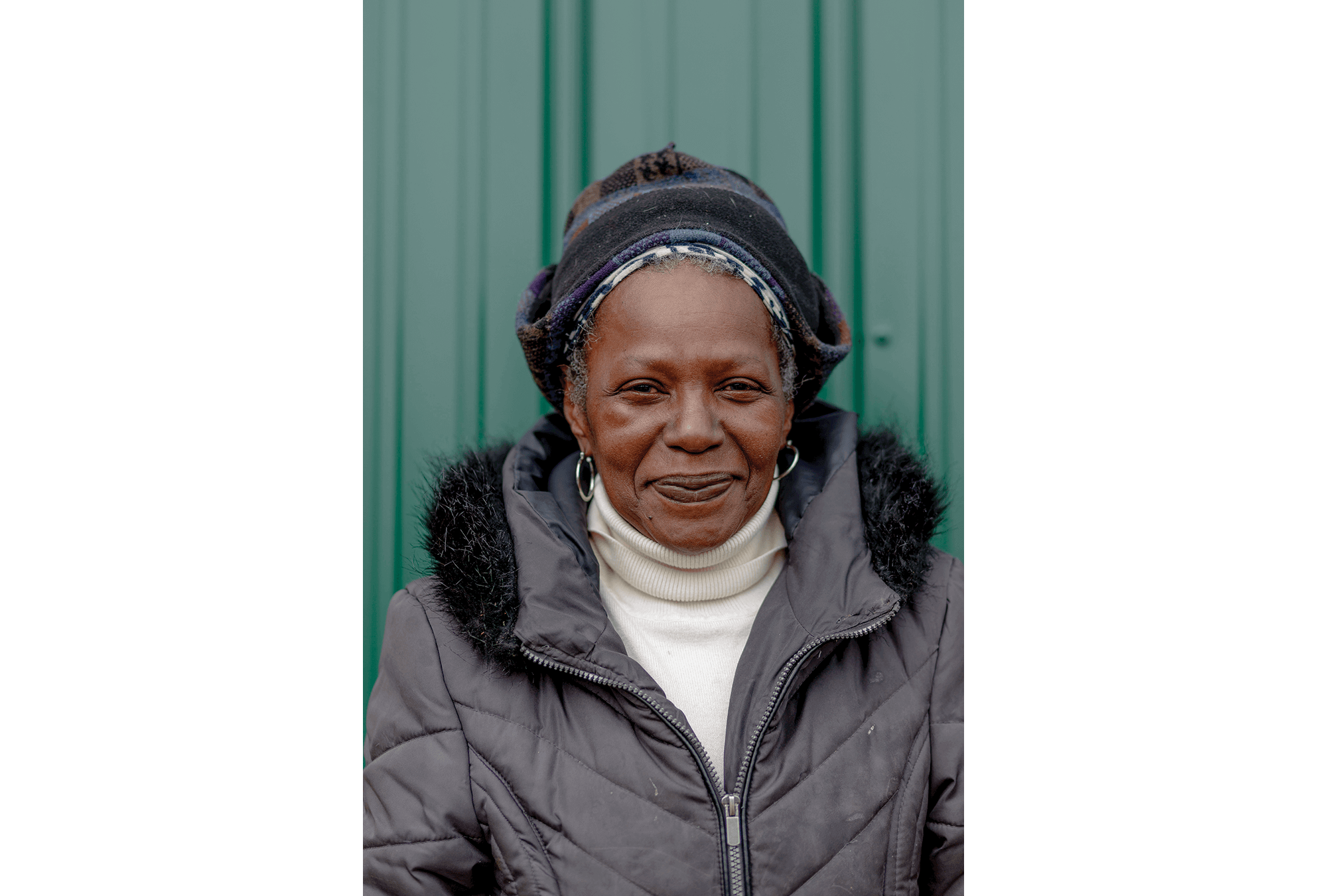 Photo Credit: Sylvia Jarrus A headshot of Donnesie Greenlaw, a Black woman, wearing winter clothing beaming at the camera