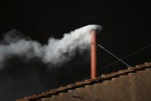 White smoke is seen from the roof of the Sistine Chapel, signaling a new pope. Peter Macdiarmid/Getty Images Peter Macdiarmid/Getty Images