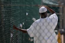 A detainee stands in an outdoor recreation yard at Joint Task Force Guantanamo’s Camp IV in 2010. by JTF Guantanamo / Flickr.com by JTF Guantanamo / Flickr.com
