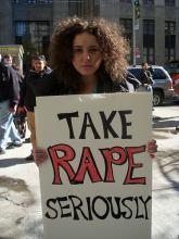 Protester holding placard, 2010. Image via Wylio. http://bit.ly/rXM1Om Protester holding placard, 2010. Image via Wylio. http://bit.ly/rXM1Om