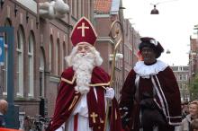 Sinterklaas and Zwarte Piet (aka "Black Pete") in a holiday parade in Holland, 2006. Photo via http://bit.ly/4rt3nE Sinterklaas and Zwarte Piet (aka "Black Pete") in a holiday parade in Holland, 2