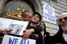 Same-sex couple celebrates outside of San Francisco City Hall Tuesday. Photo by Justin Sullivan/Getty Images (Photo by Justin Sullivan/Getty Images)