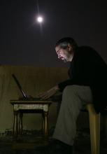 Anthony Shadid files a report by moonlinght in Iraq, 2003. Photo by Bill O'Leary/The Washington Post via Getty Images Photo by Bill O'Leary/The Washington Post via Getty Images