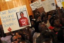 esidents of Sanford, Fla. attend to a town hall meeting 2/20 to discuss Martin's slaying. Via Getty Images. Via Getty Images.