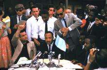 The Rev. Martin Luther King Jr., surrounded by supporters at a rally in Birmingham, 1962. Photo by Ernst Haas/Getty Images. 1962. Photo by Ernst Haas/Getty Images.