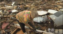 Screenshot of woman who found her dog amid tornado rubble in Moore, Okla. Screenshot of woman who found her dog amid tornado rubble in Moore, Okla.