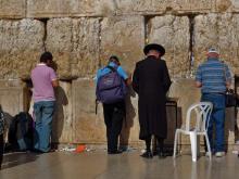 Pilgrims and tourists pray at the Wailing Wall in Jerusalem. Via Wylio http://bit.ly/wsudSt. Tourists pray at the Wailing Wall in Jerusalem. Via Wylio http://bit.ly/wsudSt.
