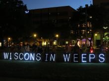 The Overpass Light Brigade at the prayer vigil in Milwaukee. Courtesy Steve Jerb