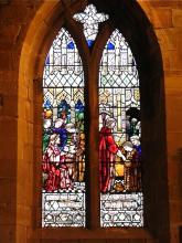 Stained glass church window depicting the Parable of the Talents from Matthew 25. Stained glass church window depicting the Parable of the Talents from Matthew 25
