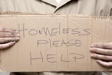 Homeless person asking for help, Kim Reinick / Shutterstock.com