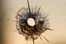 Gun shot in window, Iurii Konoval / Shutterstock.com