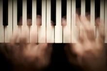 Photo: Hands playing piano, © silver-john / Shutterstock.com