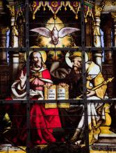 Stained glass window depicting the Holy Trinity, jorisvo / Shutterstock.com