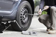 Changing a tire, mezzotint / Shutterstock.com Changing a tire, mezzotint / Shutterstock.com