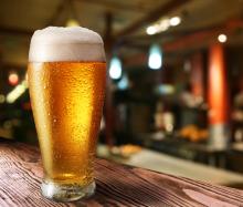 Glass of beer in a bar. Photo courtesy Valentyn Volkov/shutterstock.com