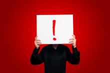 Man Holding Sign Exclamation Eugenio Marongiu / Shutterstock Man Holding Sign Exclamation Eugenio Marongiu / Shutterstock